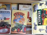 a box full of books with pictures of tractors on it