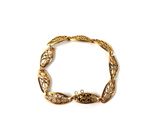 an image of a gold bracelet on a white background