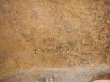 a close up of a metal object with writing on it