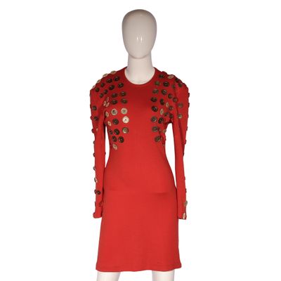 a red dress with flowers on the shoulders and shoulders