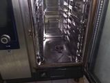 a dirty floor with a dirty oven in it