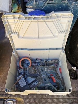 a box with tools in it sitting on the floor