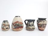 three vases that are sitting next to each other on a table