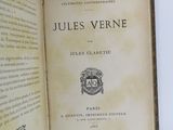 an open book with a picture of a coat of arms and a crown on it