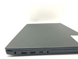 a close up of a laptop on a white surface