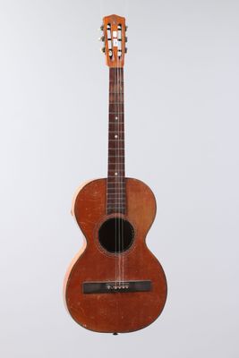 a close up of an acoustic guitar on a white background