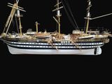 a model of a ship on display on a black background