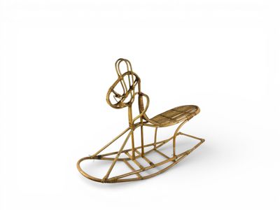 CHEVAL À BASCULE en rotin, vers 1960.