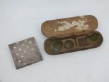 a wooden box with a pair of glasses in it