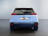 the rear end of a blue electric vehicle parked in a room