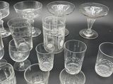 a lot of glasses that are sitting on a table