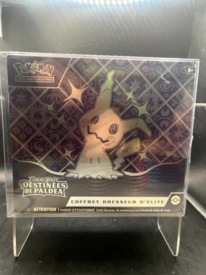 a box with a pokemon figure inside of it on a table