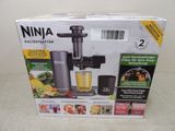 boxed box of a juicer with a blender in it on a table