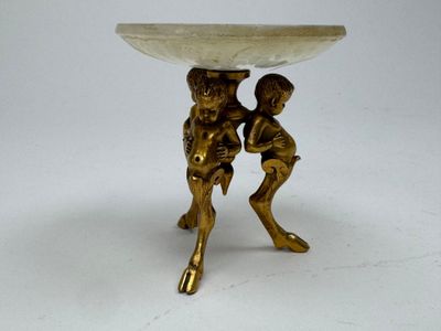 a small table that has a bowl on top of it