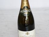 the bottle of champagne is sitting on the table