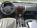 a picture of a dashboard of a car with a paper in it