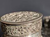a silver box sitting on top of a table