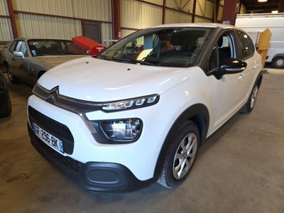 the white citrole is parked in a garage next to other cars