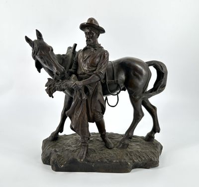 statue en bronze représentant un homme à cheval portant un chapeau