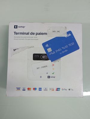 a white box with a blue credit card on it