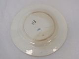 a white plate with a blue design on it