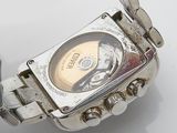 a close up of a wrist watch on a white surface