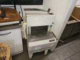 a machine that is sitting in a kitchen next to a counter