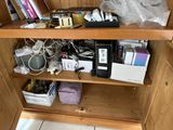 a wooden cabinet with a bunch of electronics on it