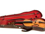 a violin in a case on a white background