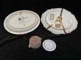 two plates and a bowl on a black table