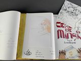 an open book with a drawing of a man on it