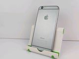 a white phone that is sitting on a stand