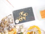 a lot of jewelry that is laying out on the table