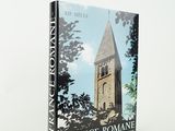 a book with a picture of a church tower in the background