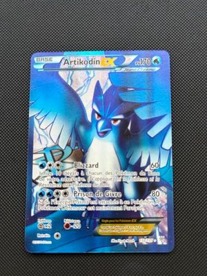 a close up of a pokemon card on a table
