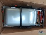 a box with a tank inside of it on the floor