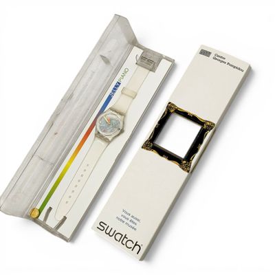 a watch sitting in a box with a watch inside of it