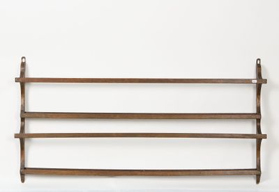 a wooden shelf that has a bunch of shelves on it