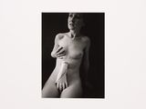a black and white photo of a naked woman in underwear