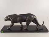 an image of a bronze statue of a panther on a black base