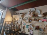 a kitchen with a lot of things on the wall