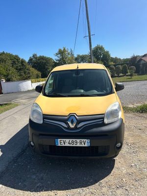 the yellow van is parked on the side of the road