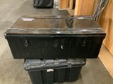 a black box sitting on top of a black box
