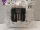four batteries in a plastic bag on a table