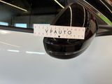 a sticker on the side mirror of a white car