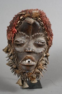 an image of a close up of a mask on a stand