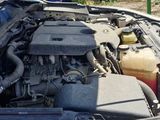 a car that has its hood open and the engine in the car