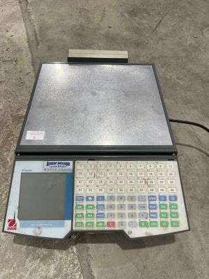 the electronic scale is sitting on the floor next to the floor