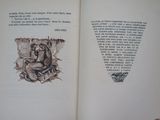 an open book with a drawing of a man sitting on a bench