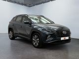 a grey 2020 hyundai kona suv parked in a showroom